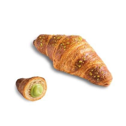 Croissant dorato con granella di pistacchio, con un pezzo più piccolo tagliato che mostra la crema al pistacchio.