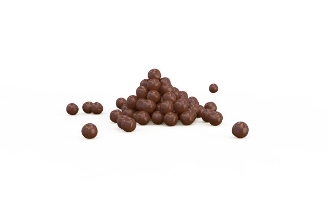 Piramide di cioccolatini rotondi con alcuni pezzi sparsi su sfondo bianco.