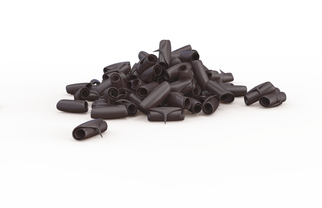 Cumulo di piccoli tappi cilindrici in plastica nera su sfondo bianco
